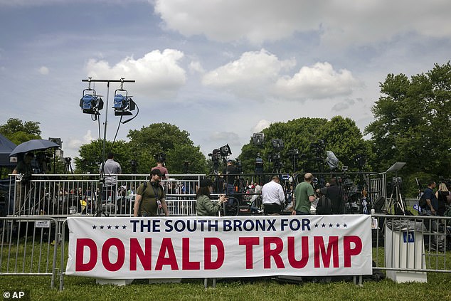 A banner in support of Republican presidential candidate former President Donald Trump is set up before a campaign rally in the Bronx