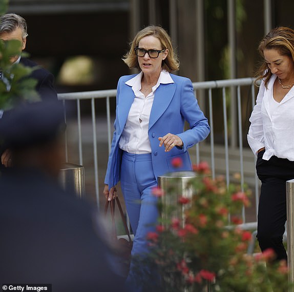 WILMINGTON, DELAWARE - JUNE 04: Kathleen Buhle (C), ex-wife of Hunter Biden, departs from the J. Caleb Boggs Federal Building on June 04, 2024 in Wilmington, Delaware. Opening statements and the questioning of the first witness took place during Biden's trial on felony gun charges. Buhle is on the list of witnesses expected to take the stand. (Photo by Anna Moneymaker/Getty Images)
