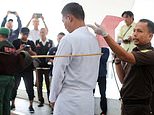 42 lashes for having a drink: Men are brutally caned for consuming alcohol and breaking Sharia law in Indonesia