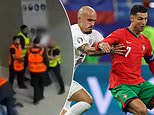 Shocking moment fan is PUNCHED and KICKED by stewards during Portugal's dramatic last-16 victory over Slovenia at Euro 2024