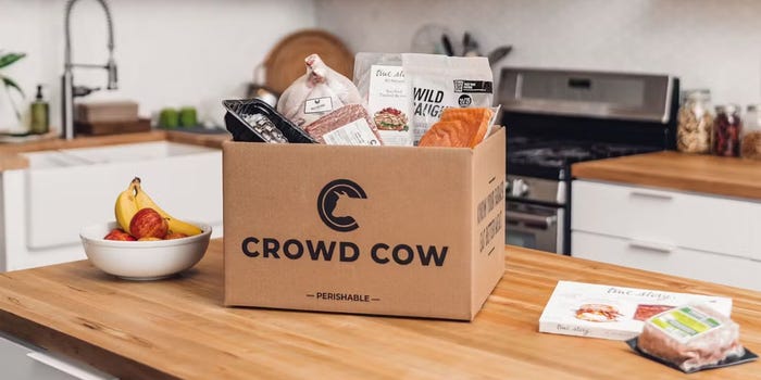 A box from Crowd Cow, a meat and seafood delivery service, full of salmon, meats, and more.