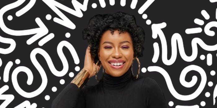 A model with natural curly hair on a black and white squiggly background.