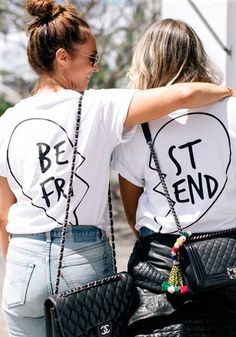 two women wearing t - shirts with the words best friend and heart on their back