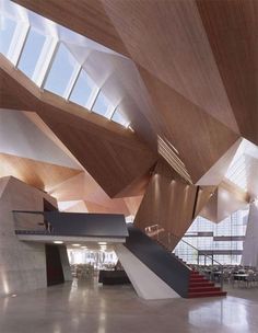 the inside of a building with many windows and stairs