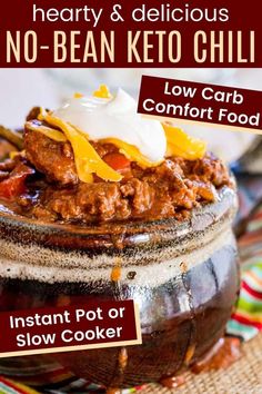 a close up of a bowl of food with text overlay reading hearty & delicious no - bean keto chili low carb comfort food