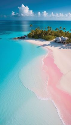 an island with pink sand and palm trees in the background, surrounded by blue water