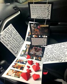 a car dashboard with several pieces of paper attached to the dash board and pictures hanging from it