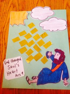 a child's artwork made out of sticky notes on a wooden table with the words god changed, paul's heart acts