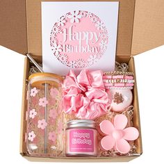 a birthday gift box filled with pink items