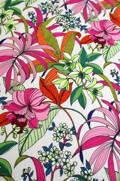 an image of colorful flowers and leaves on a white background with pink, red, green, blue, and purple colors