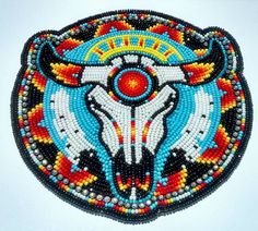 a beaded bull head on a white background