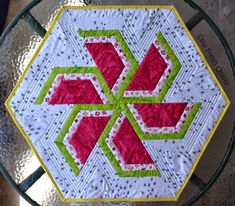 a close up of a table with a quilt on it