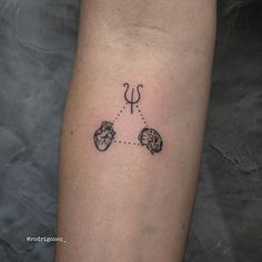 a person with a tattoo on their arm that is connected to the heart and arrow