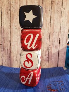 three red and white blocks stacked on top of each other with the word usa painted on them