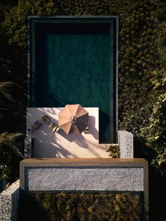 an umbrella is placed on top of a bench