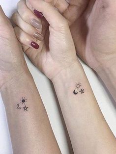 three women with matching tattoos on their arms