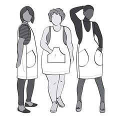 three women in aprons standing next to each other