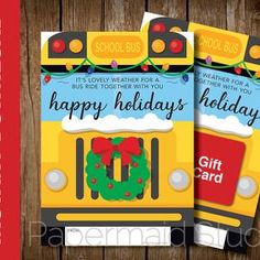 two school bus christmas cards on a wooden background