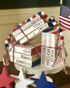a cake made to look like books with american flags on top and stars around it