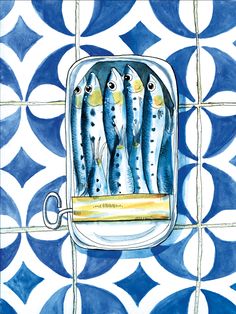 some fish are sitting in a bowl on a tile wall with blue and white tiles