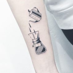 a small tattoo on the arm of a woman