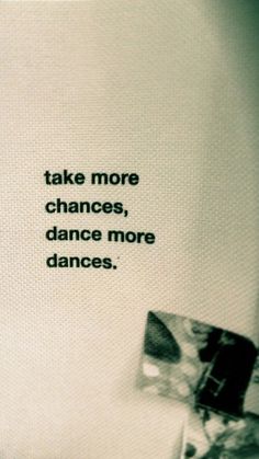 a black and white photo with the words take more chance, dance more dances on it