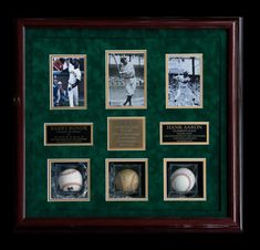 framed baseball memorabilia and autographs are on display in a wooden frame with black background