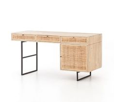 the desk is made out of rattan and has two drawers on each side, with one drawer open