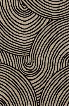 a black and white rug with wavy lines