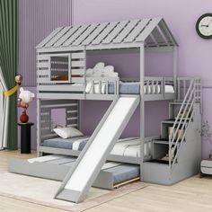 a child's bedroom with a bunk bed and slide