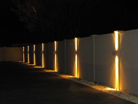 Is It Possible To Light Up Your Fence? - Straight Line Fence Fence Wall Lighting Ideas, Outside Lights On Fence, Lights On Side Of House, Fencing Lighting Ideas, Lights For Fence Posts, Fence Light Ideas, Light On Wall Ideas, Fence With Lighting, Modern Fence Lighting