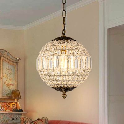 This globe crystal chandelier is a stylish blend of function with classic and vintage appeal. Crafted with a metal frame and high-quality crystal, the metal frame is wrapped handmade with crystal wire to give this fixture a special and texture look, and create a warm ambiance. Available in 3 sizes, the diameters are 12, 20, and 24 inches. Hung by a 59" adjustable chain and mounted by a sloped ceiling-compatible canopy, this classic pendant chandelier definitely fits any place in your house. | Ho Mini Chandelier Dining Room, Globe Crystal Chandelier, Lights For Sloped Ceiling, Vintage Farmhouse Chandelier, Vintage Bathroom Chandelier, Crystal Globe Chandelier, Antique Crystal Chandelier, Cottage Style Lighting Fixtures, Light Fixture Living Room