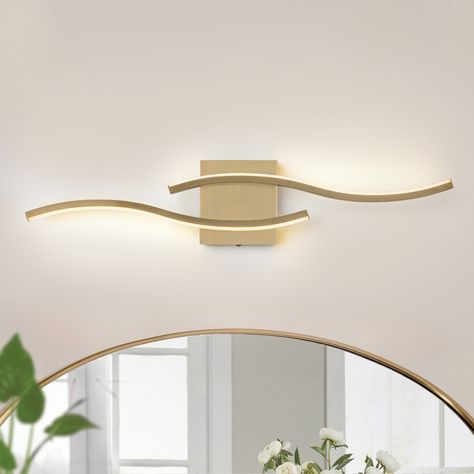 Not an ordinary 1-line bathroom light fixture, but a curved design that can add more chic decor to your modern space. This vanity lighting can be mounted horizontal or vertical for more deco flexibility. Organic Modern Bathroom Vanity Lights, Beachy Bathroom Light Fixtures, Best Lighting For Bathroom Vanity, Beach Bathroom Light Fixtures, Bathroom Vanity Lighting Over Oval Mirror, Small Powder Room Lighting Ideas, Lighting Over Bathroom Mirror, Modern Vanity Lighting Over Mirror, Vanity Lights Over Arched Mirror