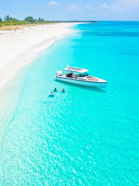 Boat floating in the clear turquoise water of the Caribbean sea off the coast of Turks and Caicos Travel, Trips, Bon Voyage, Voyage, Dream Vacations, Ocean, Nature Travel, Travel Pictures, Viajes
