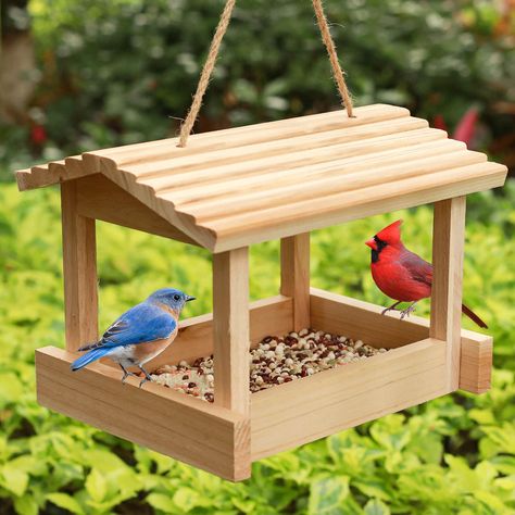 PRICES MAY VARY. 🐦BIRD FEEDER WOODEN:Attract a variety of wild birds like finches, cardinals, and chickadees to your backyard with this bird feeder. 🐦EASY TO CLEAN:- Enjoy easy cleaning and maintenance with a sturdy hemp rope for hanging.ensuring its durability and stability 🐦DIMENSION:- This hanging bird feeder dimension of 10.5" (L) x 7.5" (W) x 7.5" (H) and features a sloping roof and platform, See Wild Birds Up Close. Perfect Resting Place 🐦NICE Gift IDEA: It makes a perfect gift for any Beautiful Bird Feeders, Porch Swing Bird Feeder, Easy Diy Wooden Projects, Painted Bird Feeders Ideas, Bird Feeder Ideas, Bird Feeder House, Cousin Camp, Sloping Roof, Wooden Bird Feeders