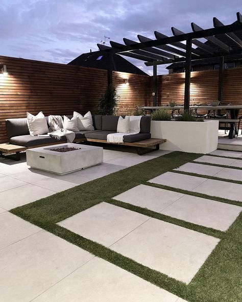 Shannen on Instagram: “Night time vibes 🌚 #landscapegarden #olivetrees #olivetree #artificialgrass #steppingstones #pergola #blackpergola #planterwalls…” Night Time Vibes, Sidewalk Landscaping, Small Backyard Garden Design, Backyard Design Ideas Budget, Steel Door Design, House Balcony Design, Backyard Landscaping Plans, Patio Small, Modern Backyard Landscaping