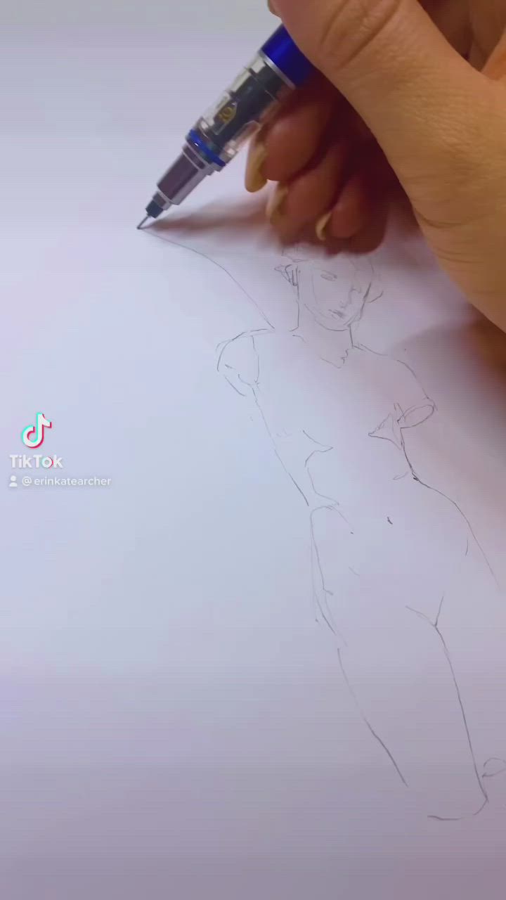 This may contain: someone is drawing a fairy on paper with colored pencils