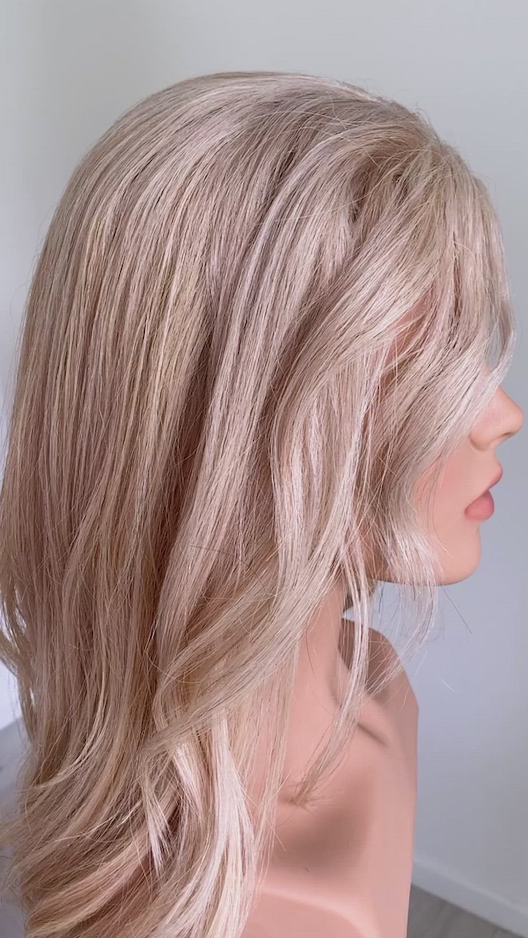 This may contain: a close up of a person holding a hair comb