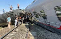 people are seen near the derailed carriages of a passenger train after a collision with a truck in the volgograd region in russia on july 29 2024 photo reuters