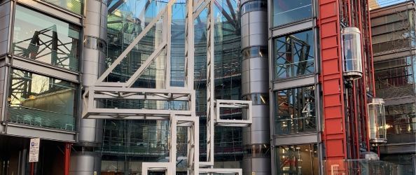 A metal number '4' structure outside the offices of Channel 4 in London.