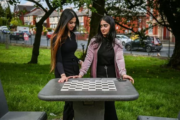Laiba Amjad (left) and Marwa Ahmed at the controversial chess board