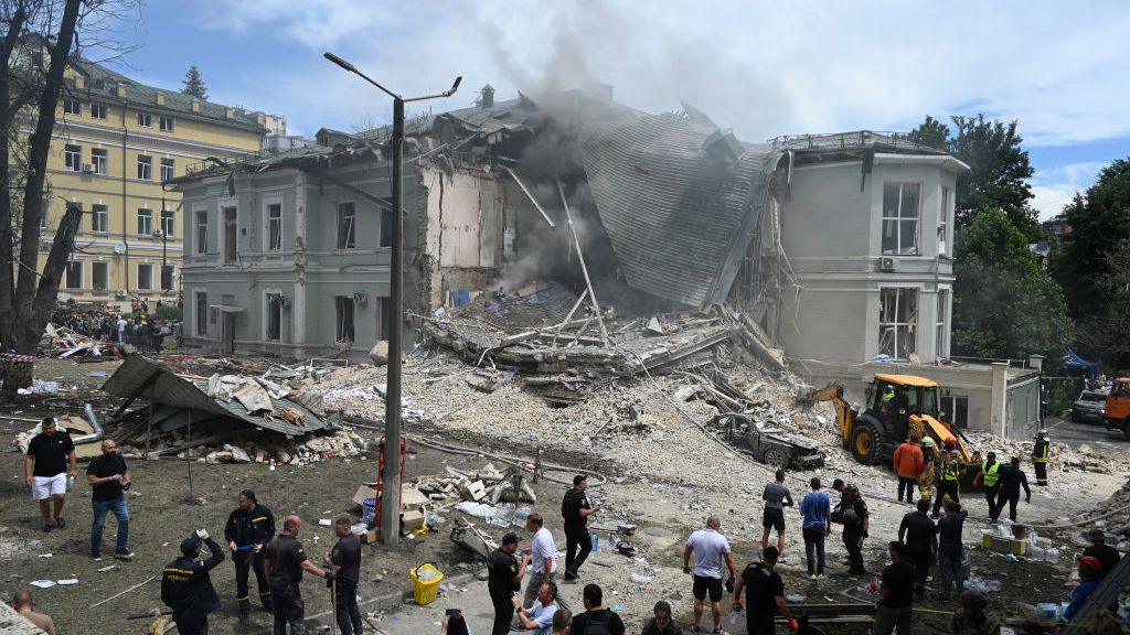 Ukrainian rescuers of emergency services and police officers are working at the site of Okhmatdyt children's hospital 