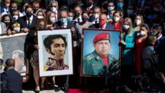 First lady of Venezuela, Cilia Flores, and Chavistas leaders Diosdado Cabello and Jorge Rodriguez, among others, participate in a floral offering at Plaza Bolivar in Caracas, Venezuela, 05 January 2021.