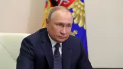 Russian President Vladimir Putin chairs a meeting outside Moscow