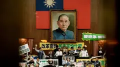 TOPSHOT - The Legislative Yuan is covered with posters and banners during a vote on the parliamentary reform bill, in Taipei on May 24, 2024. Tens of thousands of Taiwanese protesters rallied day and night outside parliament on May 24, as lawmakers inside traded insults, blows and theatrics over a series of bills to expand the legislature's power. (Photo by Yasuyoshi CHIBA / AFP) (Photo by YASUYOSHI CHIBA/AFP via Getty Images)