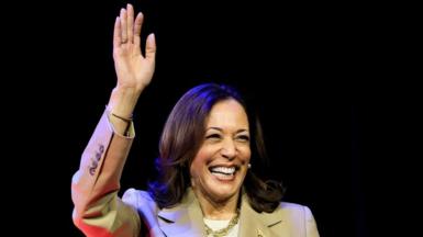 Kamala Harris waves and smiles