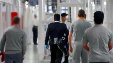 prison officers and prisoners walking around HMP Pentonville