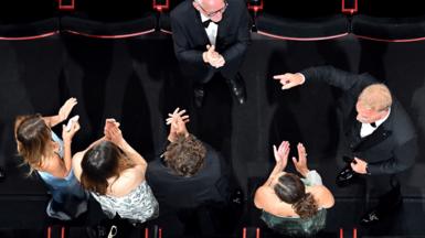 An overhead view of people standing and applauding at the Cannes Film Festival