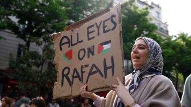 A woman holds a sign saying 'All Eyes on Rafah' at a protest at the Sorbonne University in Paris