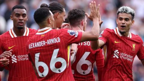 Luis Diaz celebrates with his Liverpool team-mates after scoring against Bournemouth in the Premier League